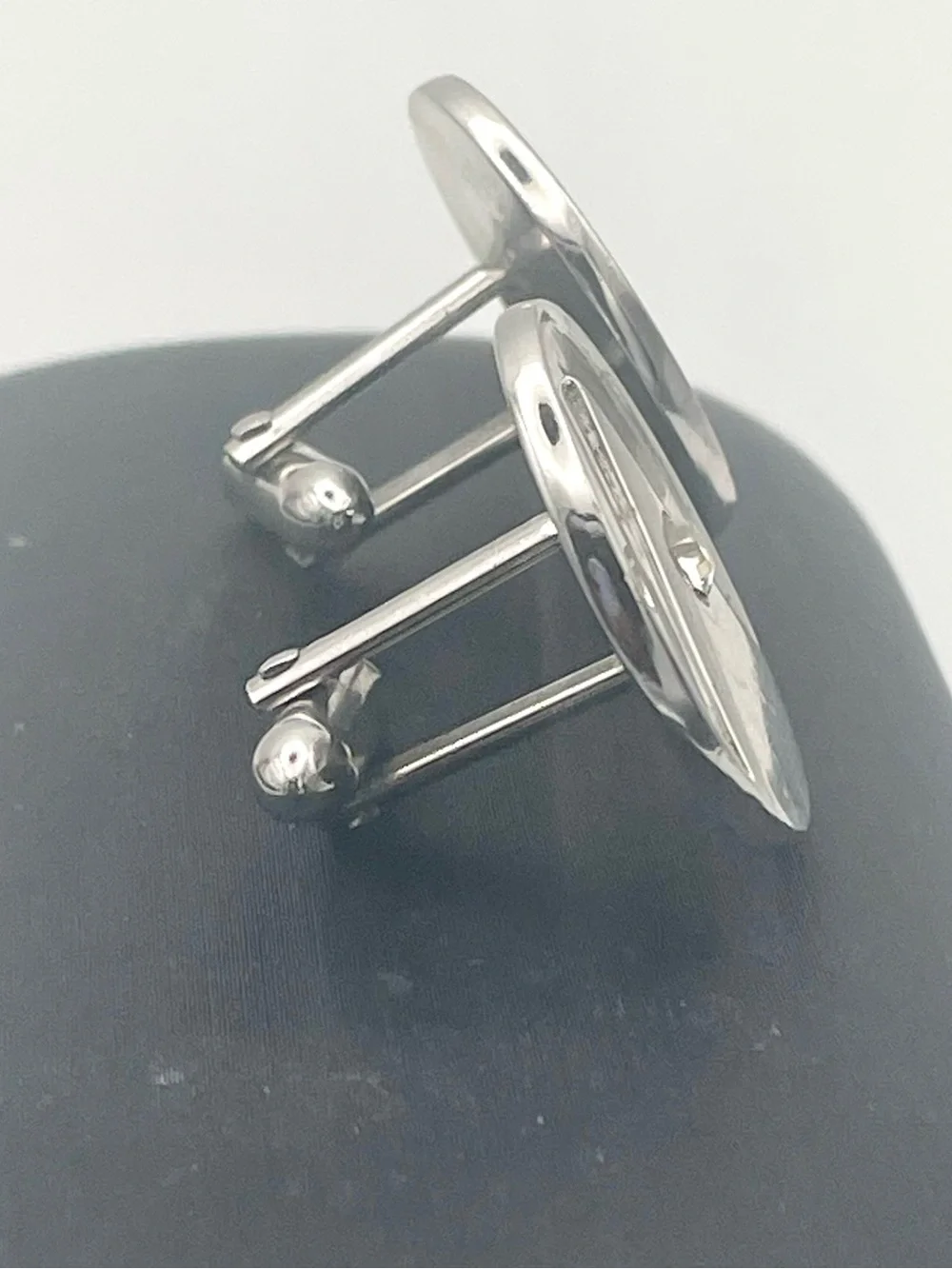 Silver Round Cufflinks with Triangle Emblem Inlaid with Crystal Detail